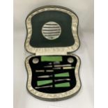 AN ART DECO CASED MANICURE SET WITH JADE STYLE HANDLES