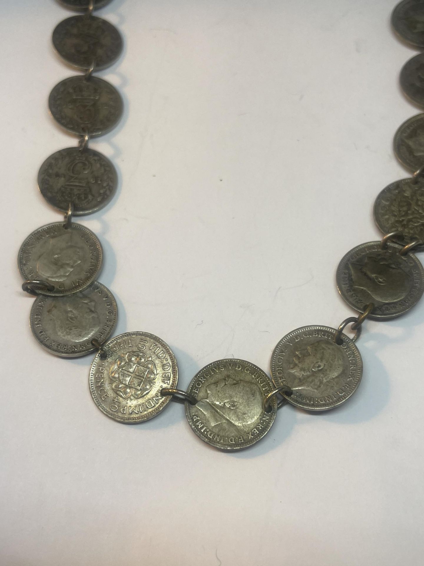 A NECKLACE MADE UP OF NINETEEN SILVER THREE PENCES - Image 3 of 5