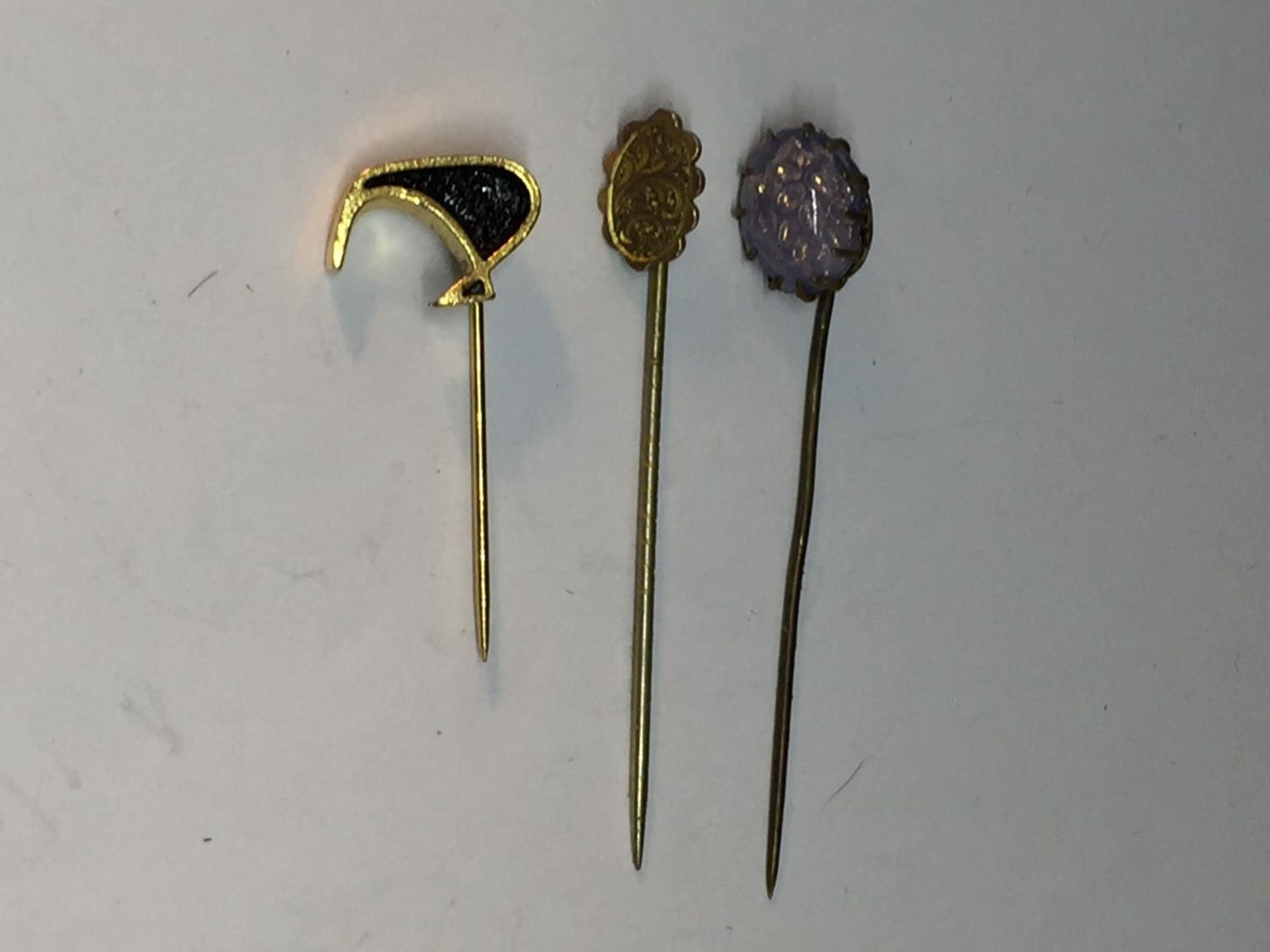 THREE PIN BROOCHES