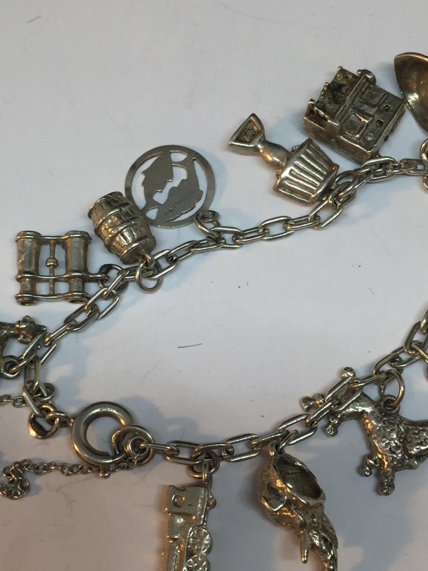 A SILVER CHARM BRACELET WITH FOURTEEN CHARMS - Image 3 of 4