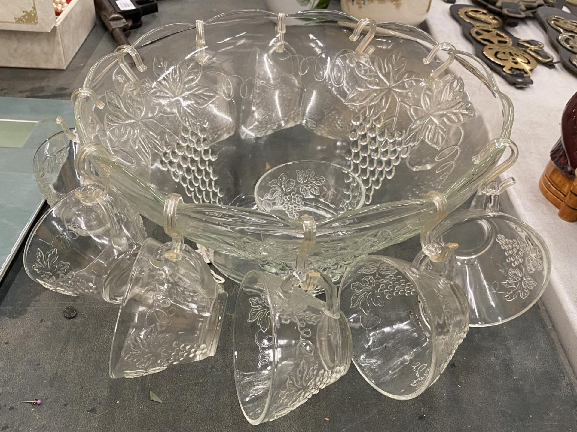 A GLASS PUNCH BOWL WITH CUPS DECORATED WITH GRAPES, TWO CHAMPAGNE FLUTES, ETC - Image 2 of 4