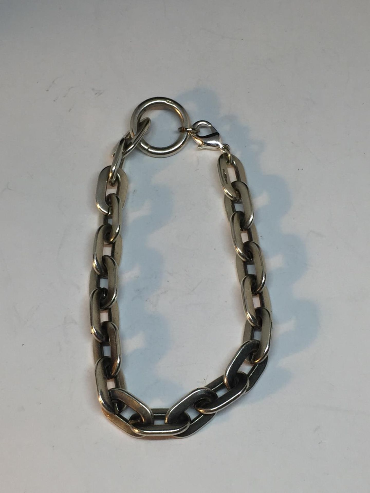 A HEAVY SILVER WRIST CHAIN