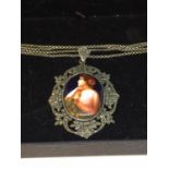 A SILVER NECKLACE WITH PORTRAIT PENDANT IN A PRESENTATION BOX