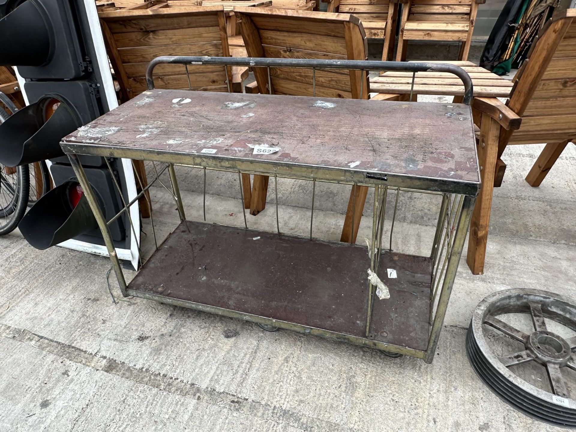 A WOODEN AND METAL FOUR WHEELED TROLLEY