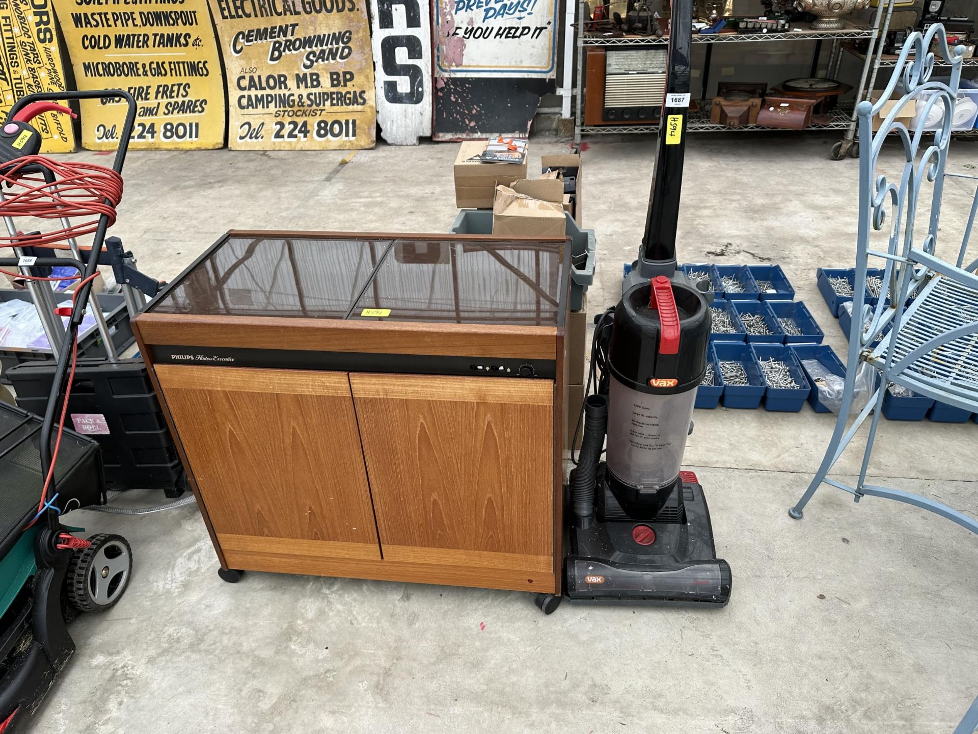 A VAX VACUUM CLEANER AND A PHILIPS HOSTESS TROLLEY