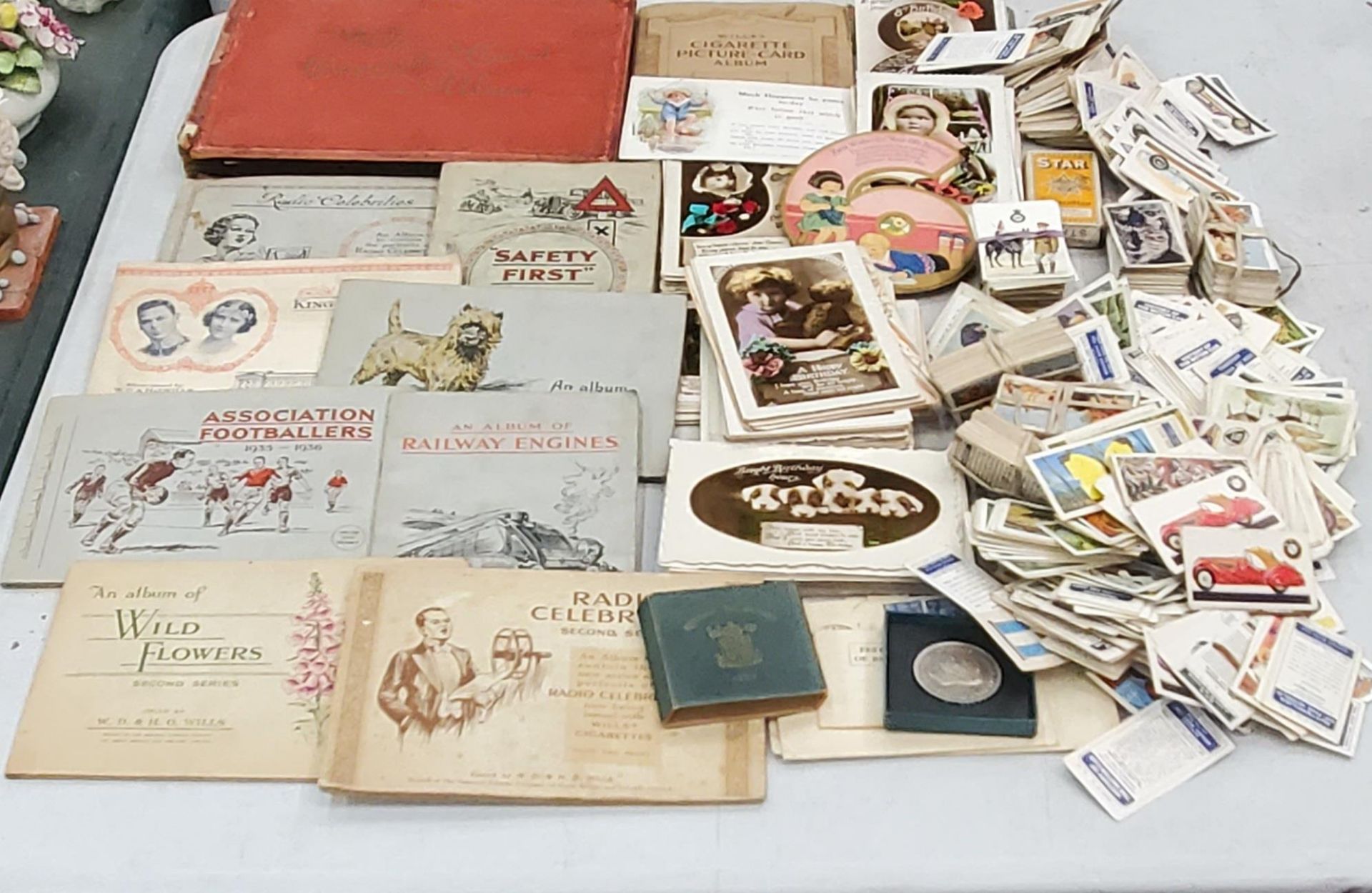 A COLLECTION OF VINTAGE CIGARETTE CARD ALBUMS TOGETHER WITH LOOSE EXAMPLES