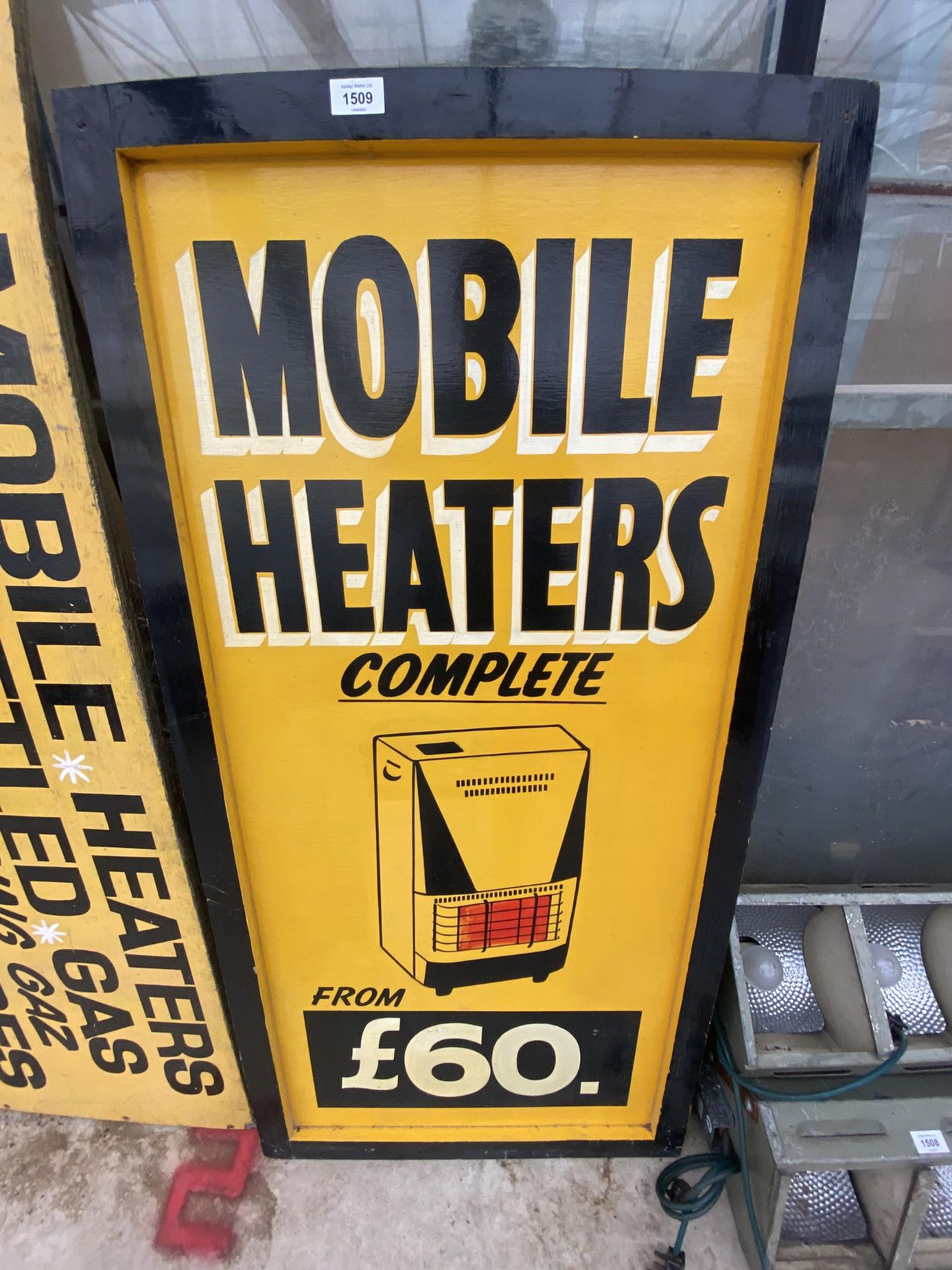 A VINTAGE WOODEN 'MOBILE HEATERS' SIGN
