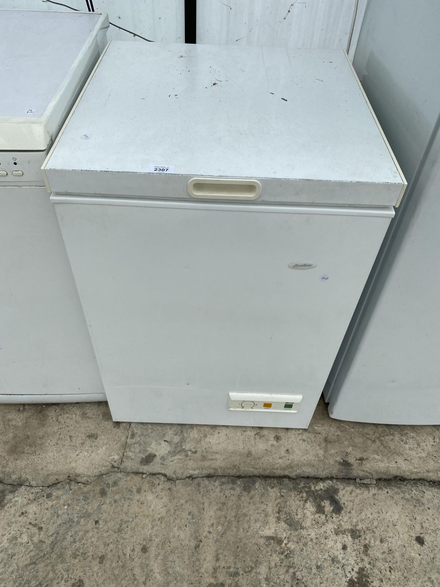 A SMALL WHITE CHEST FREEZER