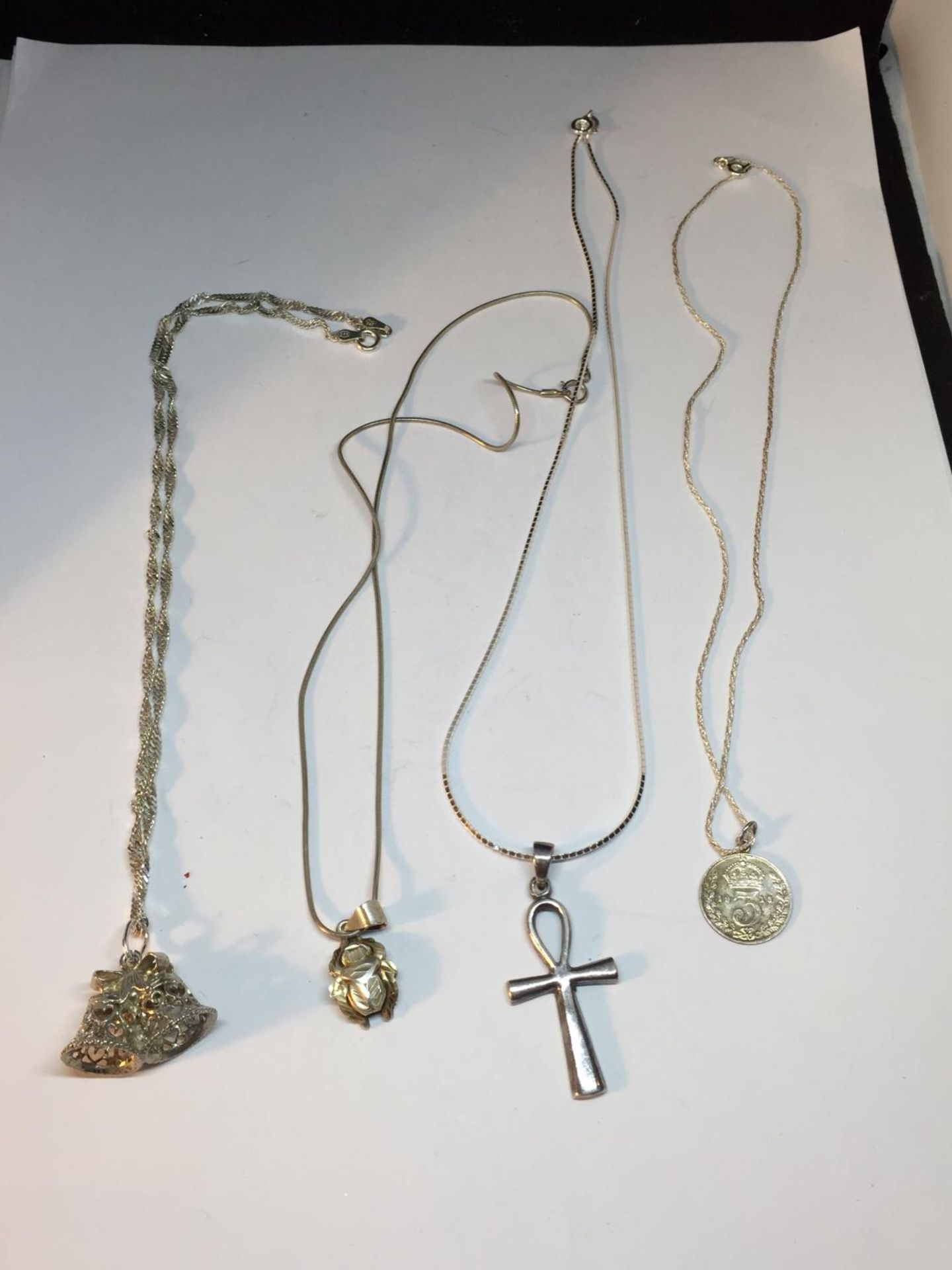 FOUR SILVER NECKLACES WITH PENDANT