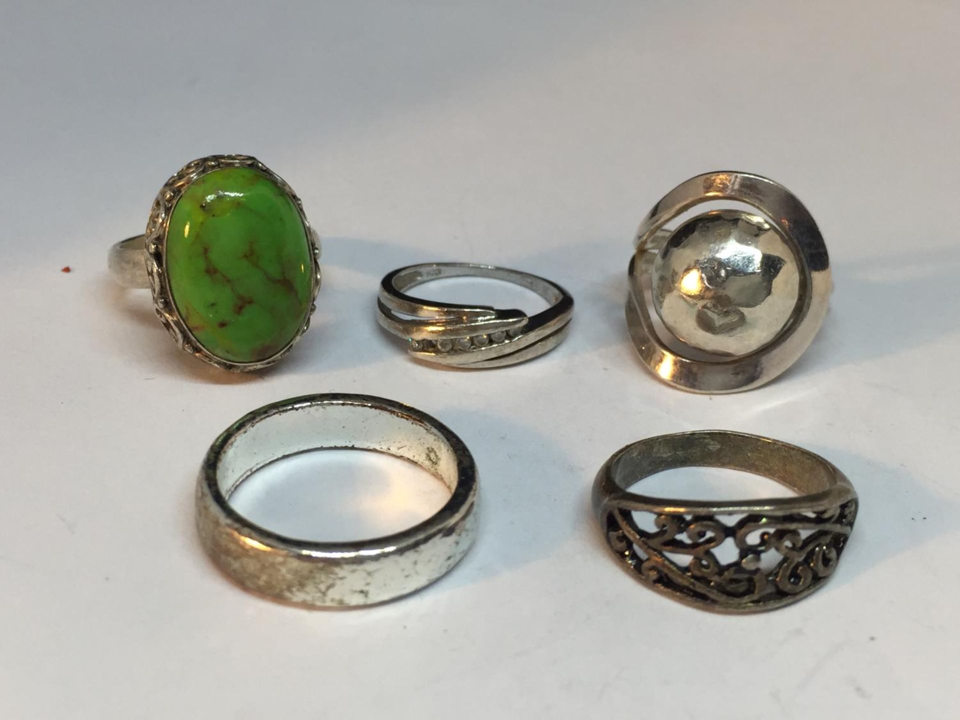 FIVE SILVER RINGS