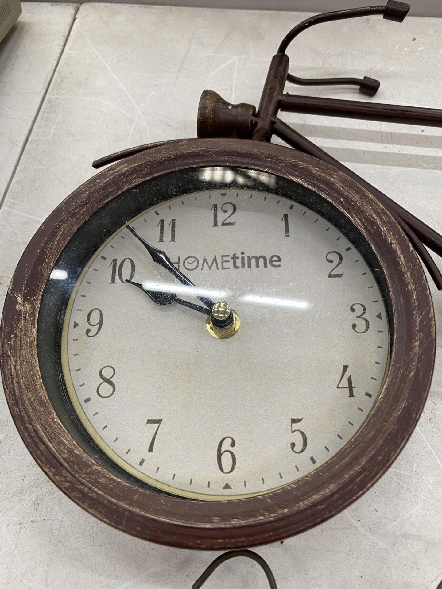 A WROUGHT IRON CLOCK IN THE SHAPE OF A BIKE AND A TIN PLATE COFFEE SIGN - Image 2 of 2