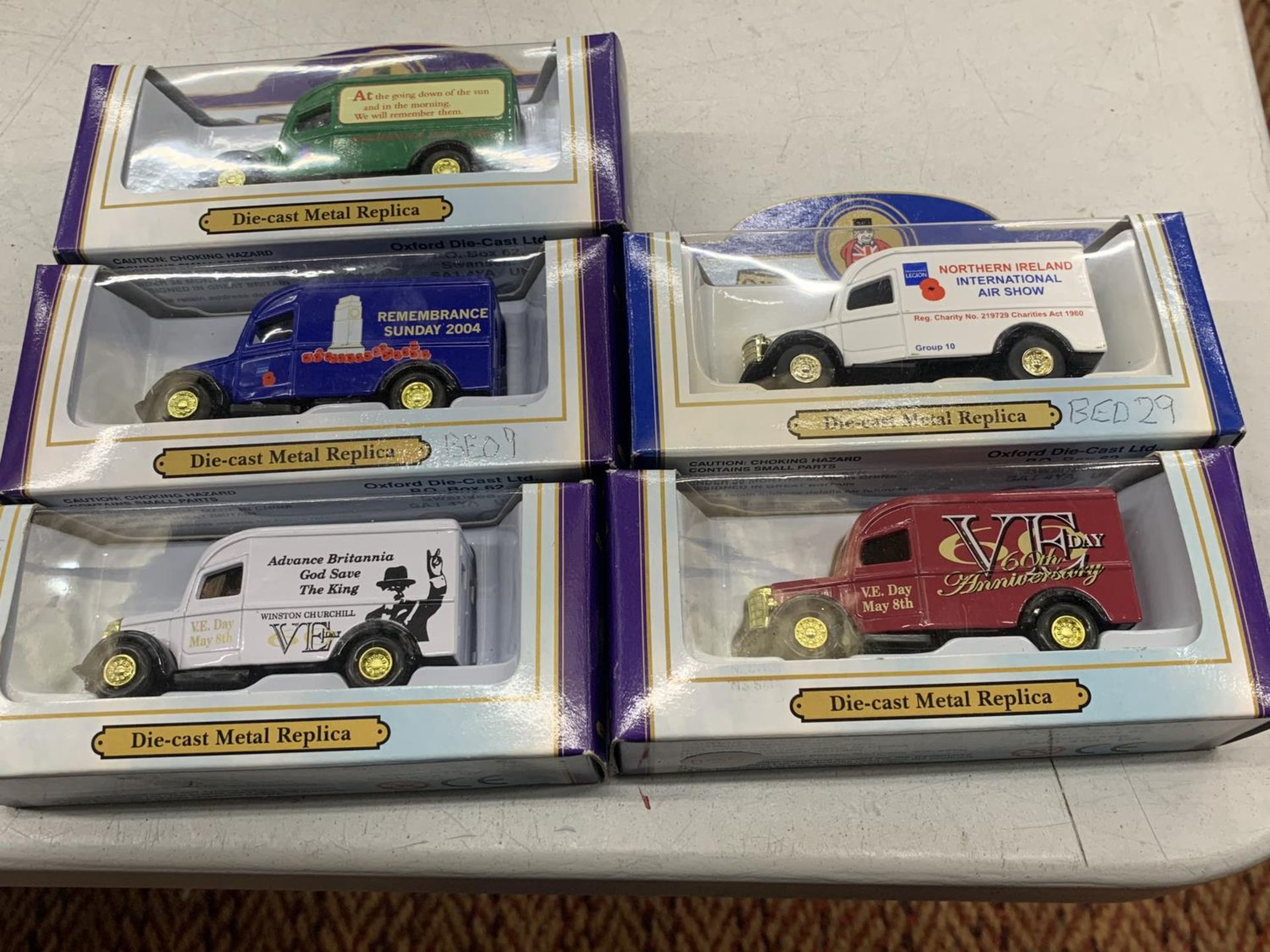 FIVE OXFORD DIECAST BOXED BEDFORD VANS ANNIVERSARY MODELS