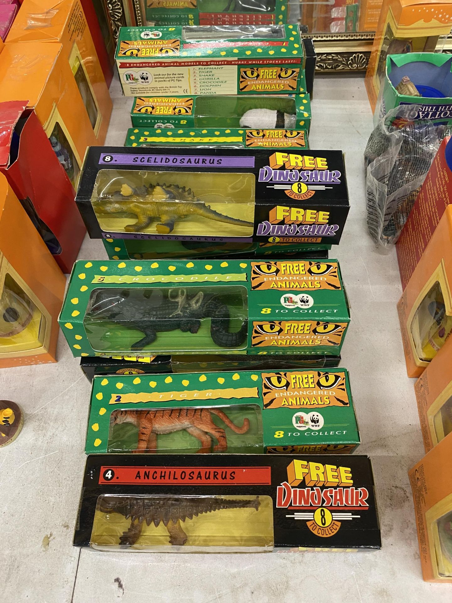 A COLLECTION OF BOXED PG TIPS AND WWF ENDANGERED ANIMALS AND DINOSAUR TOYS