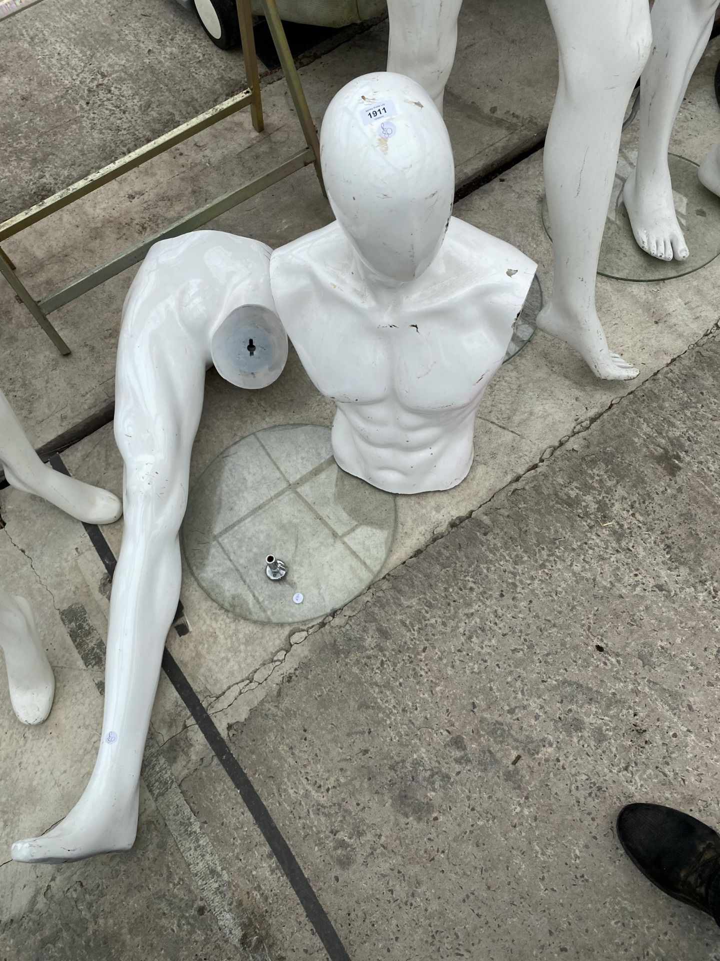 A MALE MANNEQUIN WUITH STAND FOR SPARES