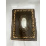 A VICTORIAN PHOTO ALBUM WITH SILVER PLATE ON FRONT PRESENTATION PLAQUE DATED 1883