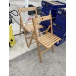 A PAIR OF FOLDING WOODEN CHAIRS