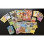 A TIN OF ASSORTED POKEMON CARDS, HOLOS, LARGE OVERSIZED DRAGONITE V, INFERNAPE AND KLEAVOR ETC