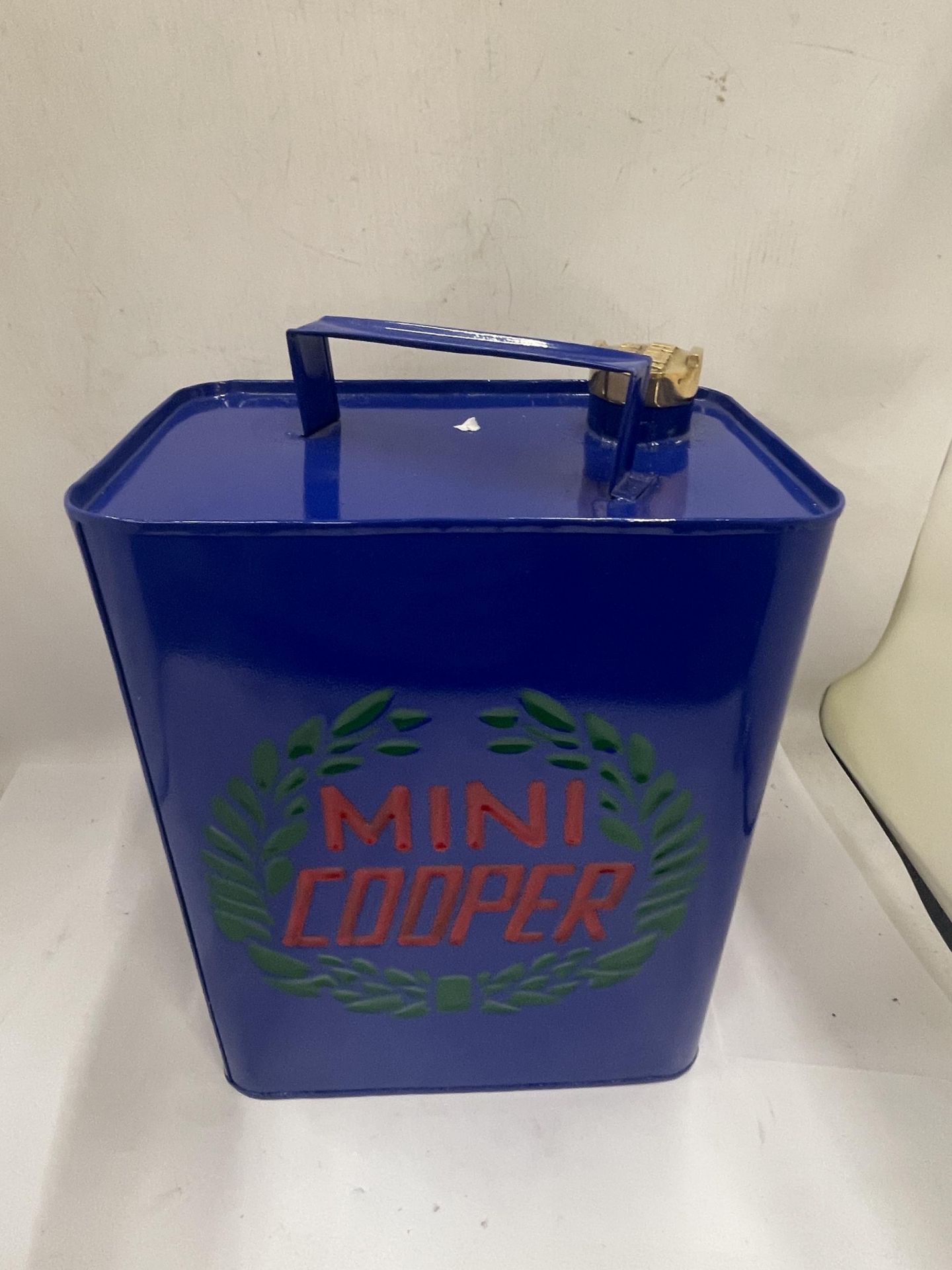 A BLUE MINI COOPER PETROL CAN WITH BRASS TOP