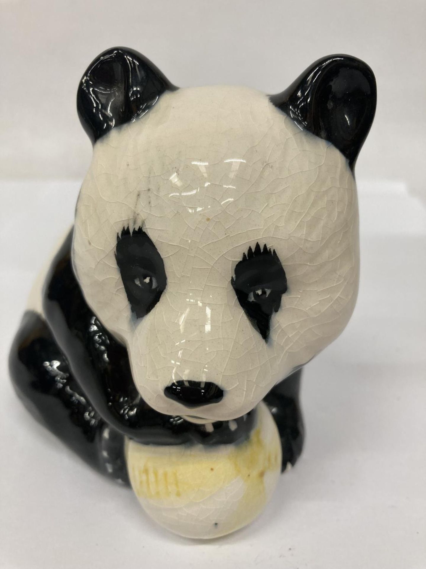 A BESWICK PANDA WITH A BALL