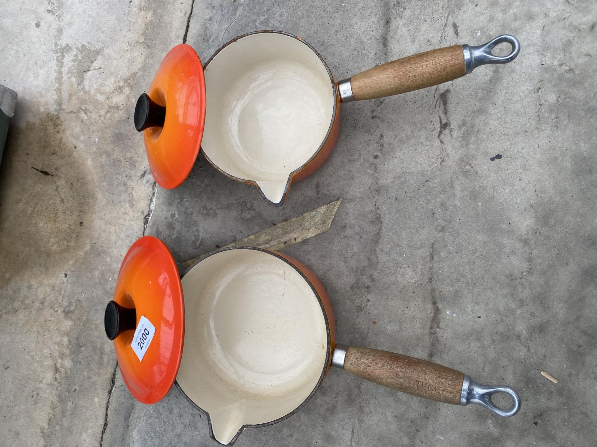 TWO ORANGE LE CREUSET PANS WITH WOODEN HANDLES AND LIDS - Image 2 of 4