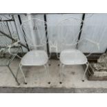 A PAIR OF DECORATIVE TURNED METAL BISTRO CHAIRS