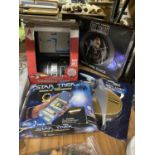 FOUR BOXED STAR WARS ITEMS TO INCLUDE TWO WALL CLOCKS, AN ELECTRONIC CONSOLE BANK AND A MEDICAL