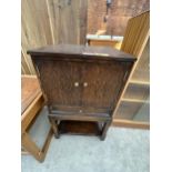 A VINTAGE OAK SEWING CABINET