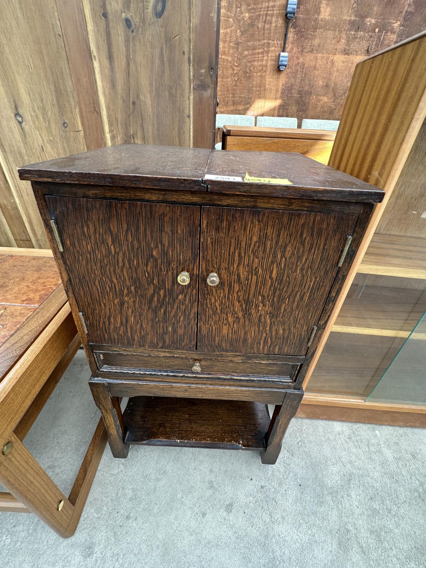 A VINTAGE OAK SEWING CABINET