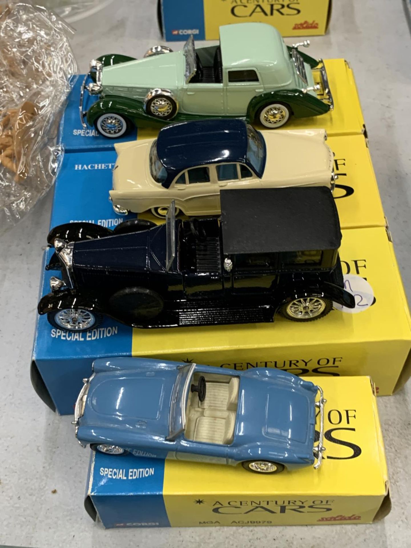 FOUR BOXED CORGI 'A CENTURY OF CARS' TO INCLUDE AN MGA, SIMBA, DELOGE COUP DE VILLE AND A PANHARD ET