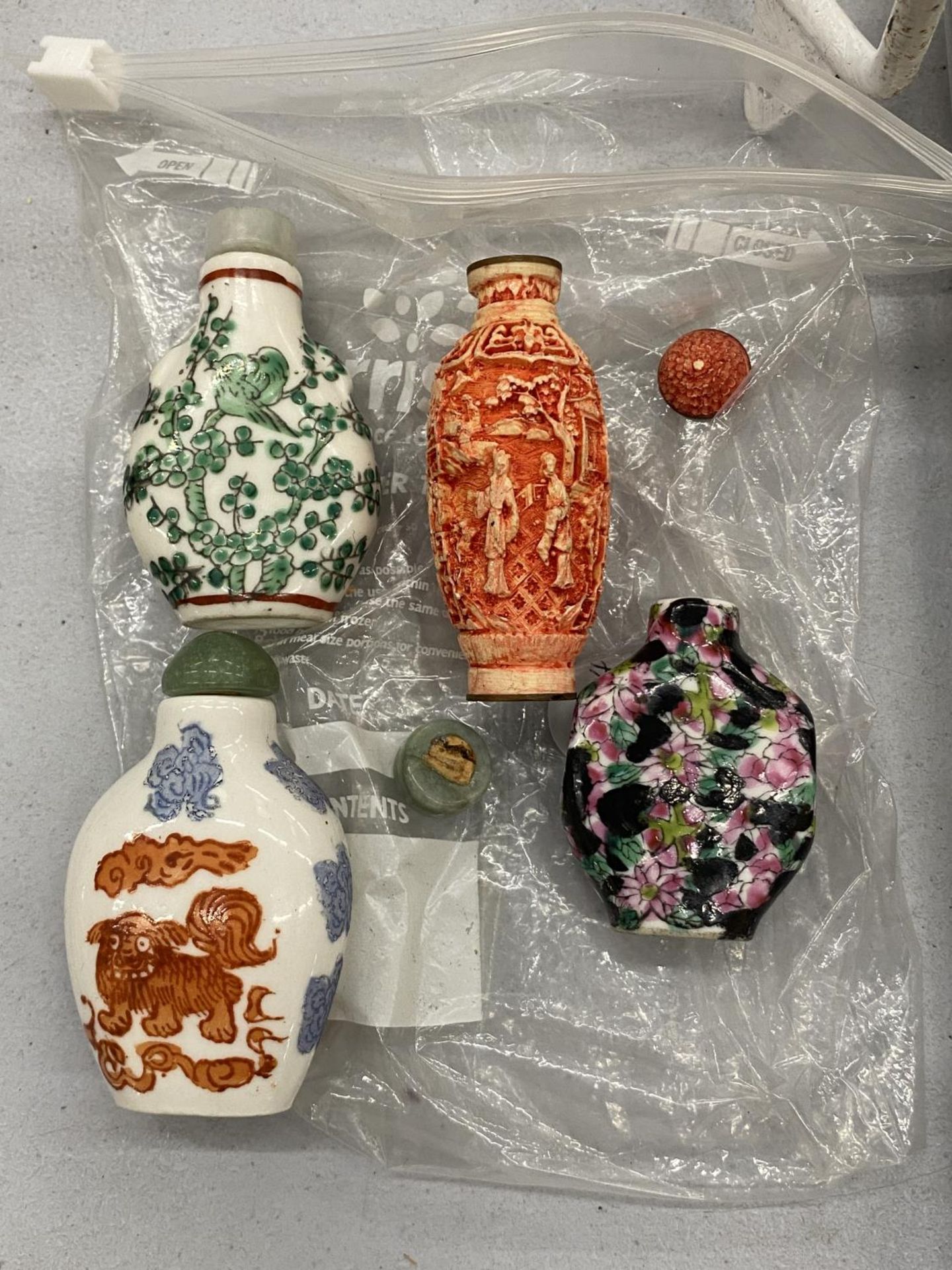 FOUR ORIENTAL SNUFF BOTTLES WITH MARKS TO THE BASE