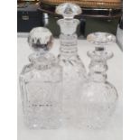 THREE VINTAGE CUT GLASS DECANTERS