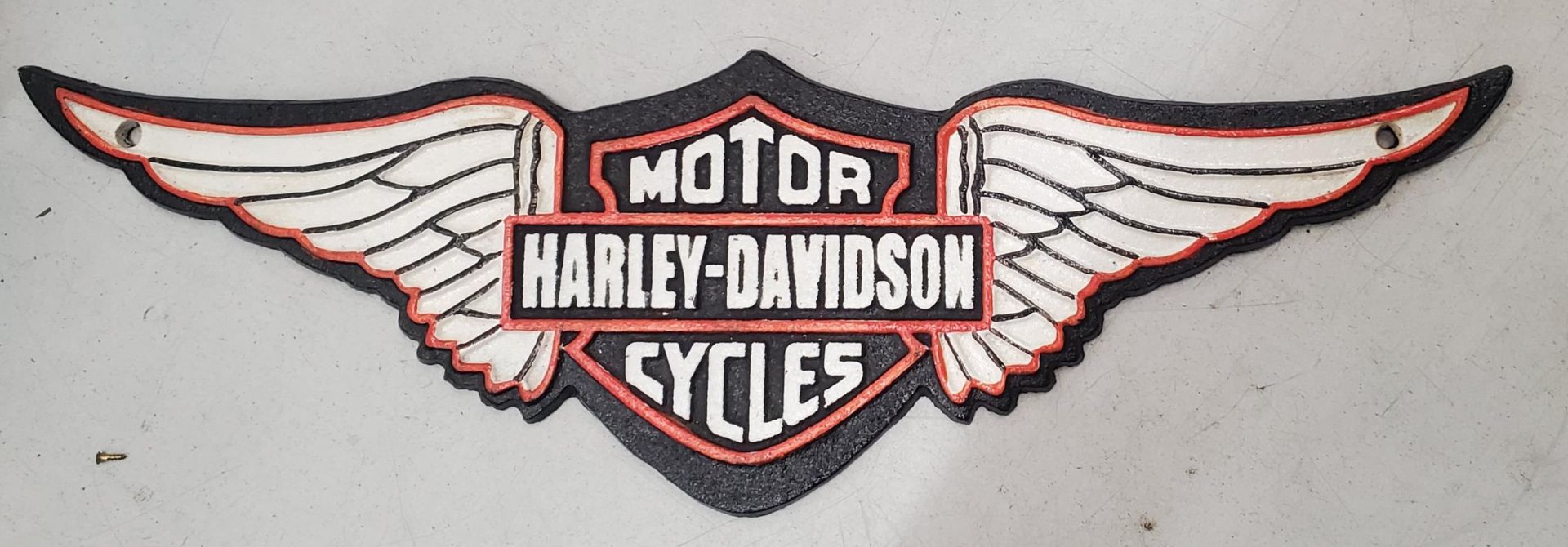 A CAST HARLEY DAVIDSON MOTOR CYCLE SIGN