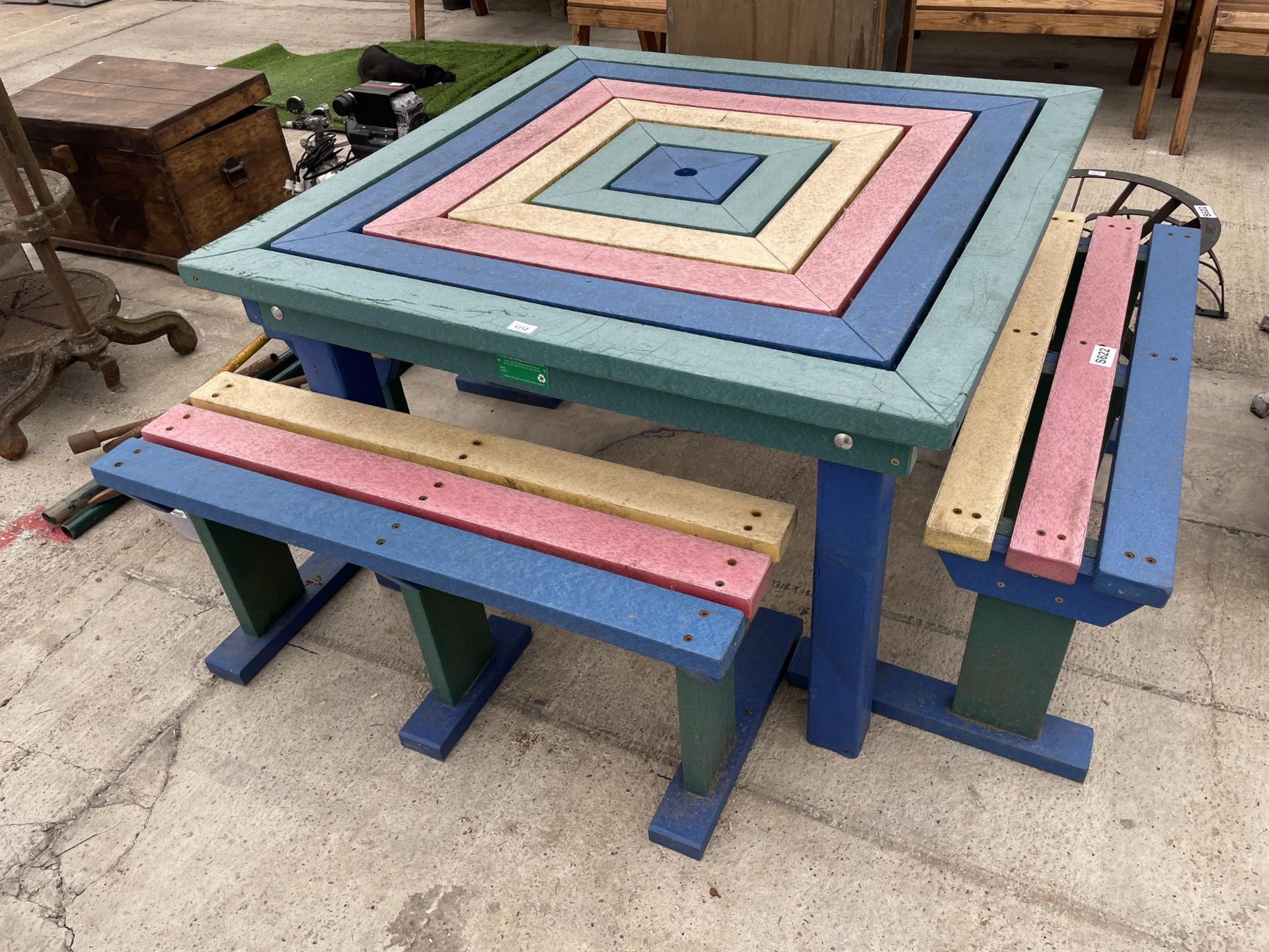 A HEAVY DUTY PLASTIC PICNIC TABLE AND THREE BENCHES