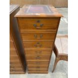 A MAHOGANY FOUR DRAWER FILING CABINET WITH INSET LEATHER TOP