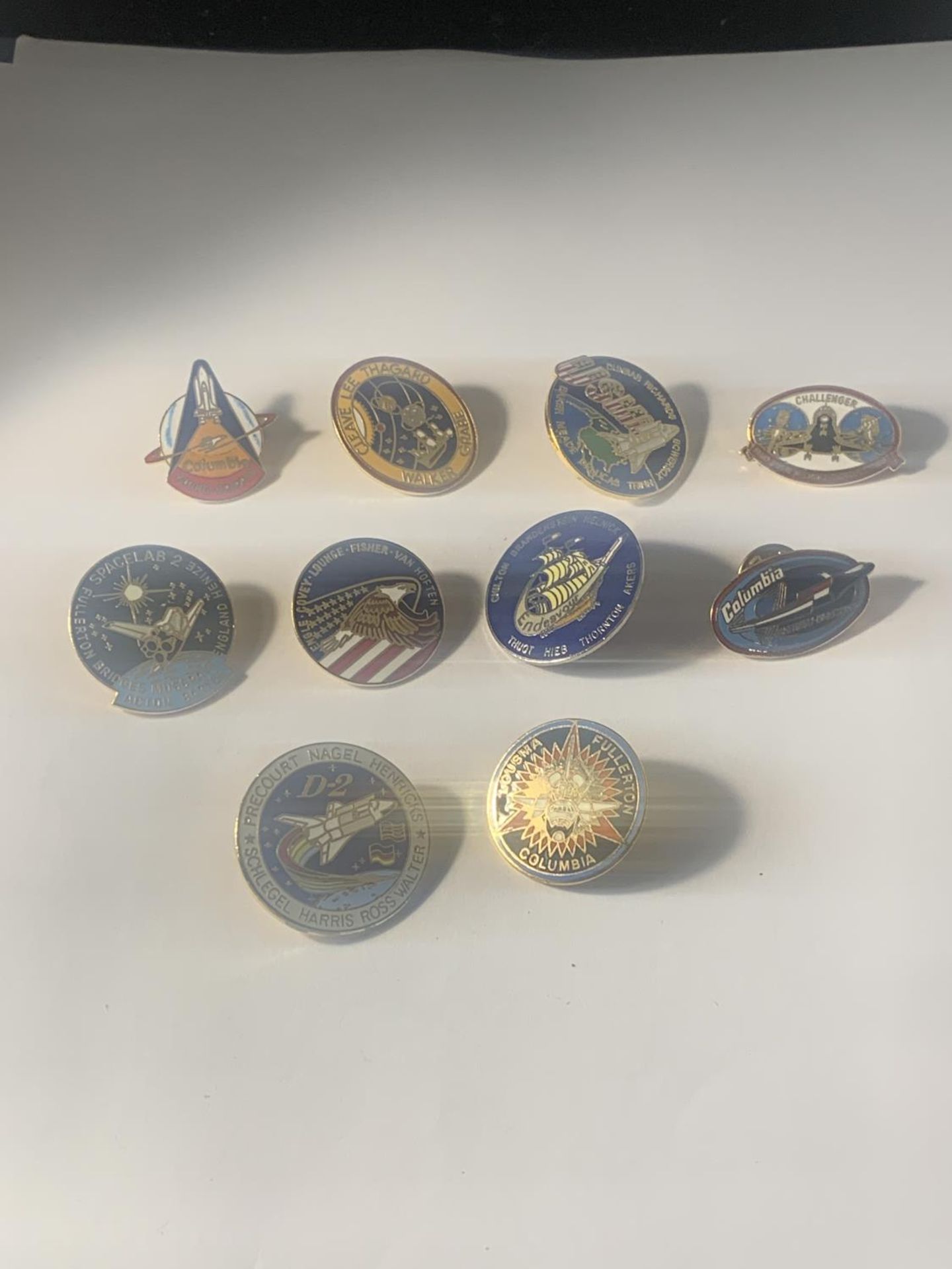 TEN NASA SPACE SHUTTLE BADGES