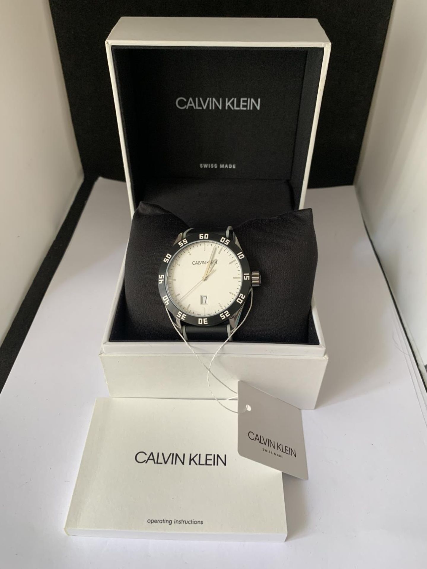 AN AS NEW AND BOXED CALVIN KLEIN CALENDAR WRIST WATCH SEEN WORKING BUT NO WARRANTY