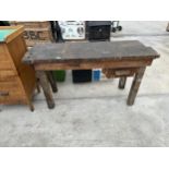 A SMALL VINTAGE WOODEN WORKSHOP BENCH WITH LOWER DRAWER