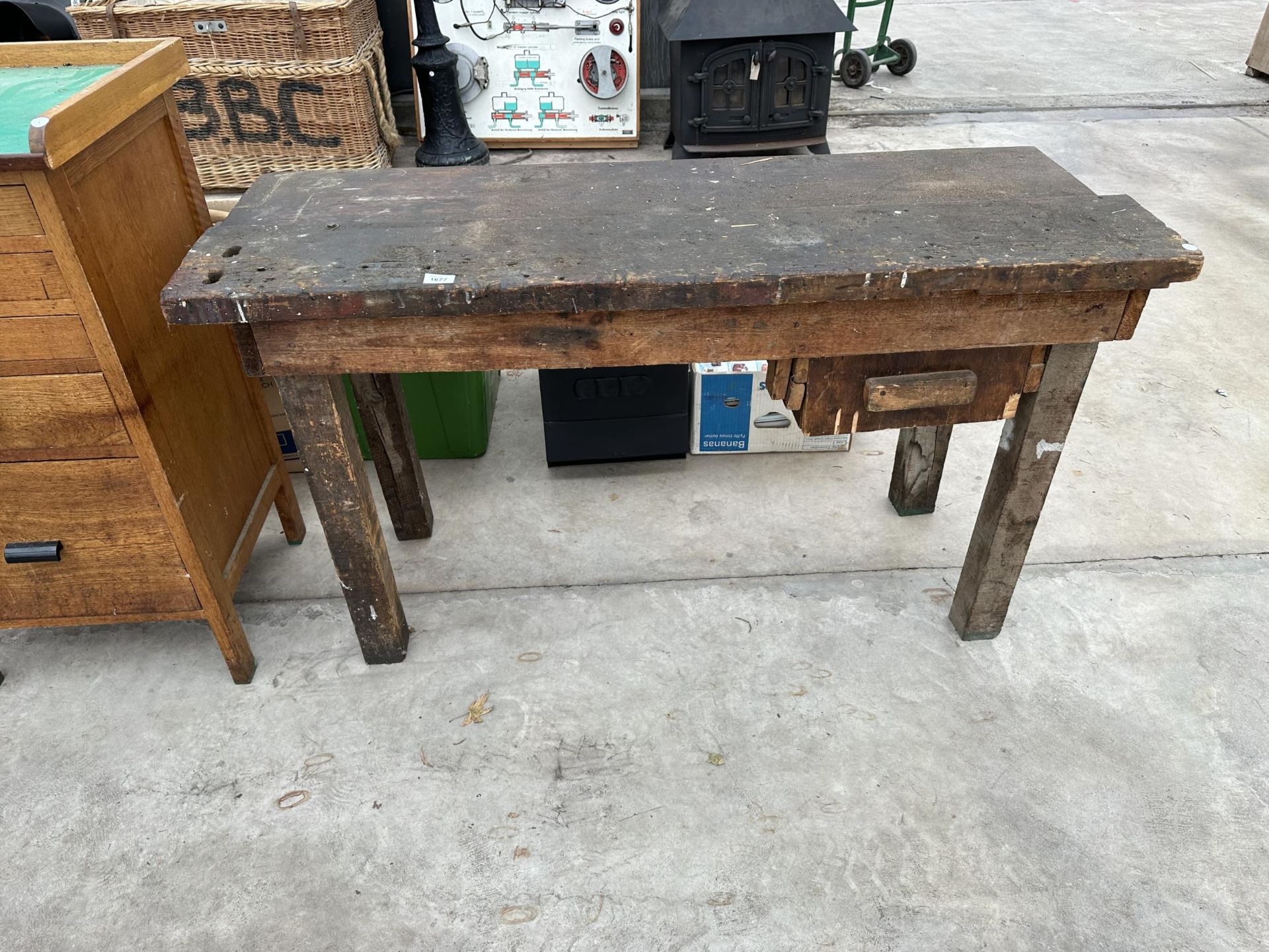A SMALL VINTAGE WOODEN WORKSHOP BENCH WITH LOWER DRAWER