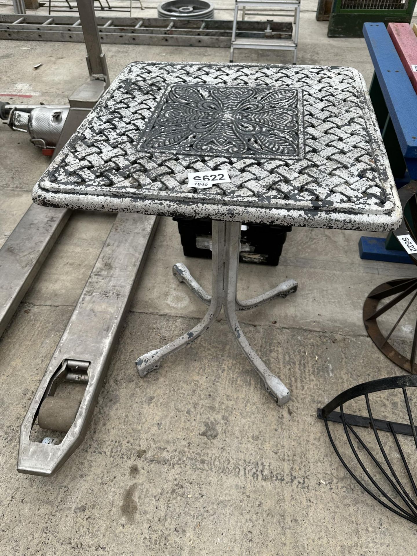 A SQUARE CAST ALLOY BISTRO TABLE