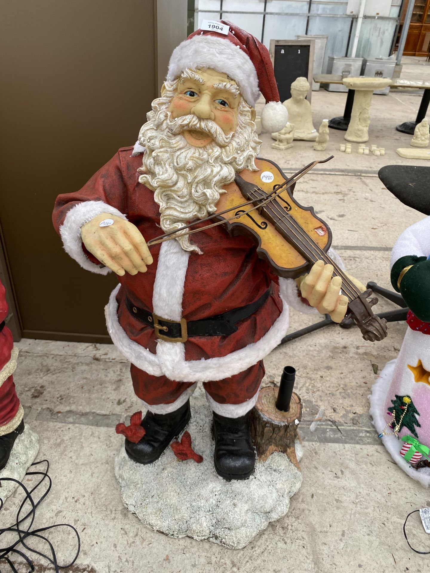 A PLUG IN SANTA CHRISTMAS DECORATION