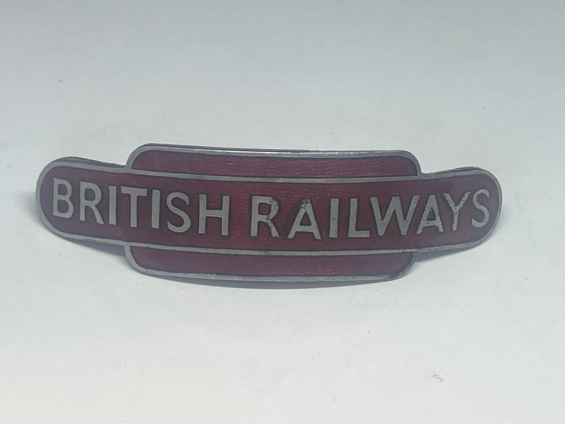 A VINTAGE BRITISH RAIL ENAMEL PORTERS CAP BADGE (J R GAUNT LONDON)