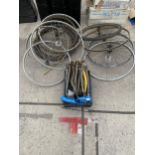 A LARGE QUANTITY OF BIKE WHEELS AND SCREW ON HYDRAULIC PIPES