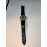 A VINTAGE POTENS 17 RUBIS INCABLOC WRIST WATCH WITH BLACK LEATHER STRAP SEEN WORKING BUT NO WARRANTY