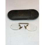 A PAIR OF VINTAGE PINCE NEZ IN A CASE MARKED WOOTEN AND WEBB LUTON