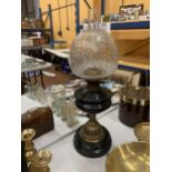 A VINTAGE BRASS AND GLASS OIL LAMP ON MARBLE BASE