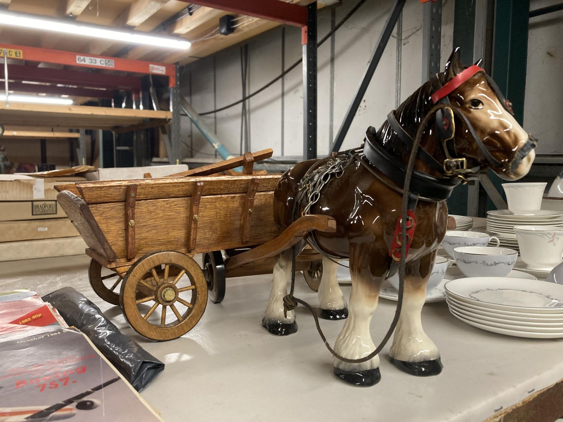 A CERAMIC SHIRE HORSE WITH WOODEN CART