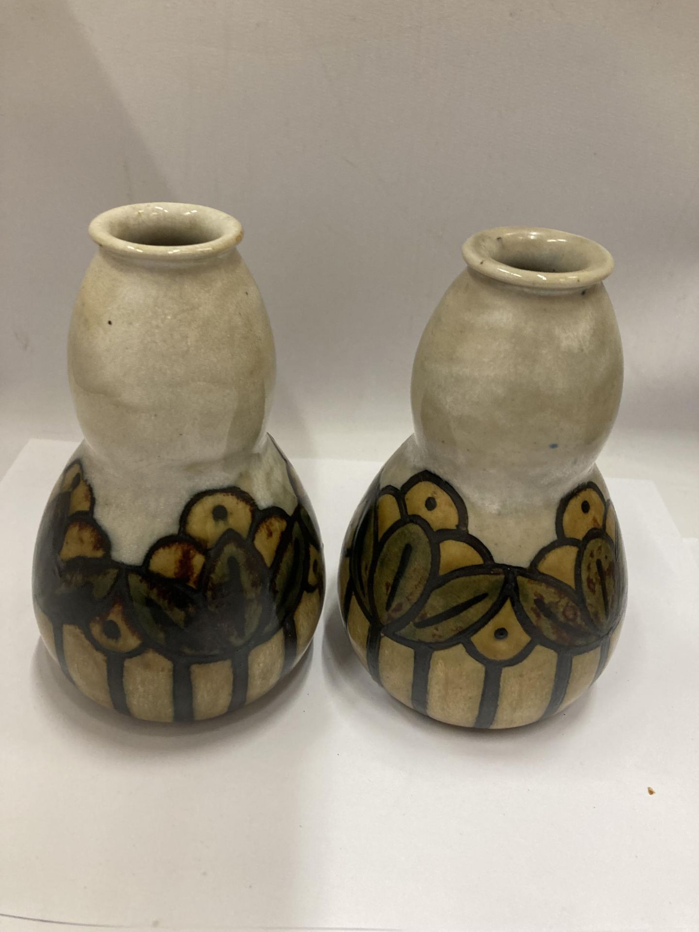 A PAIR OF EARLY ROYAL DOULTON VASES