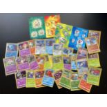 A TRAINER BOX OF ASSORTED POKEMON CARDS, HOLOS, TOKENS ETC