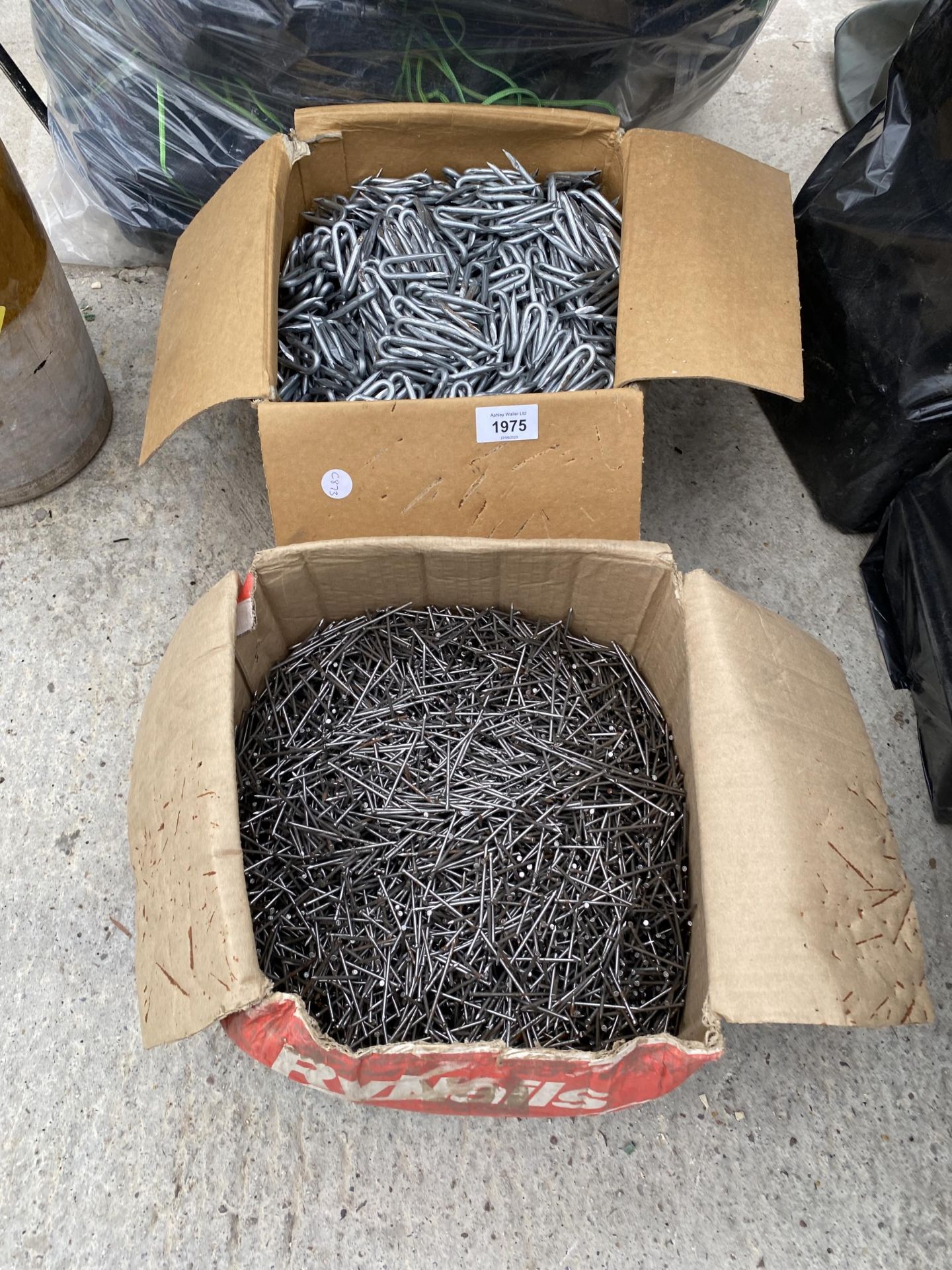 A LARGE QUANTITY OF HARDWARE TO INCLUDE NAILS AND FENCING STAPLES