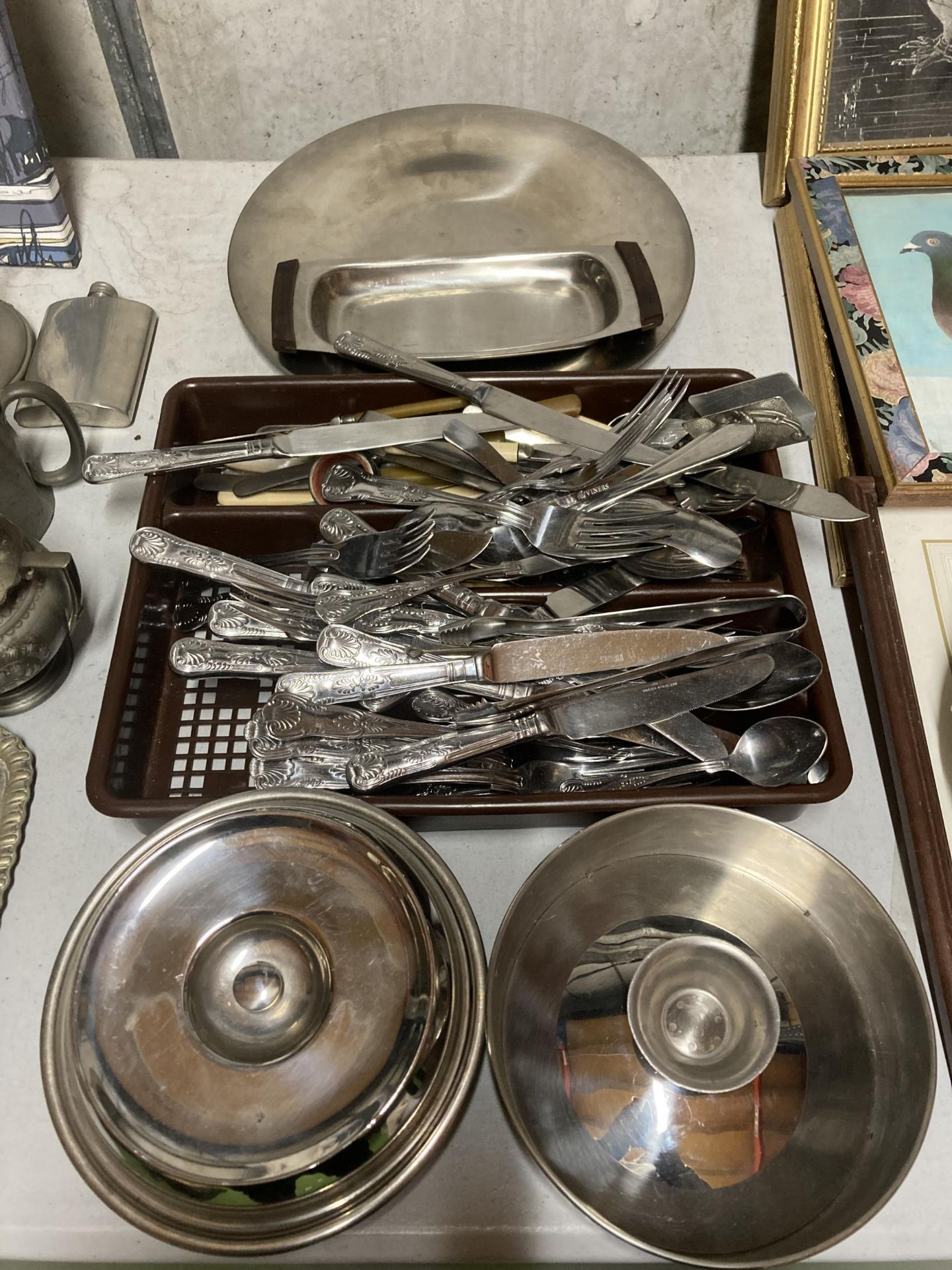 A GROUP OF SILVER PLATED FLATWARE AND STAINLESS STEEL DISHES
